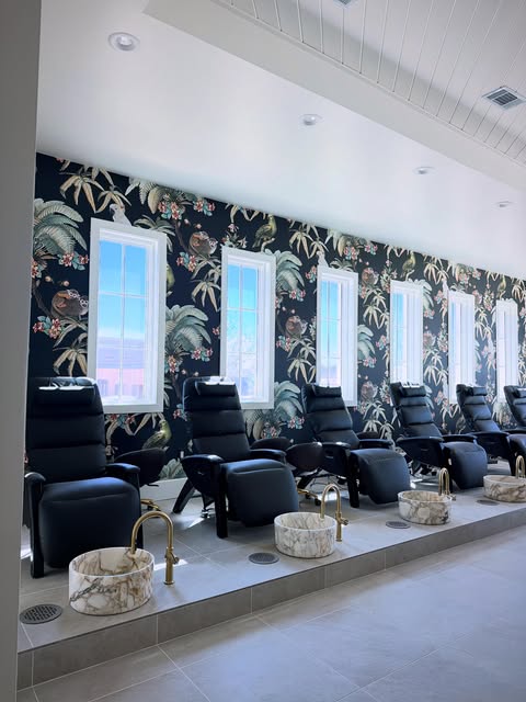 Pedicure chairs and botanical wallpaper at Kubu Bali